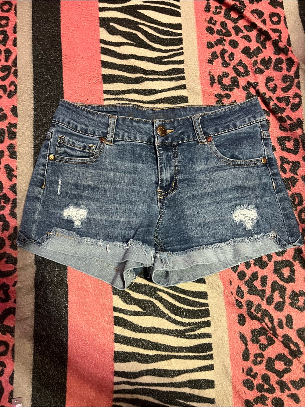 Celebrity pink ripped jean shorts